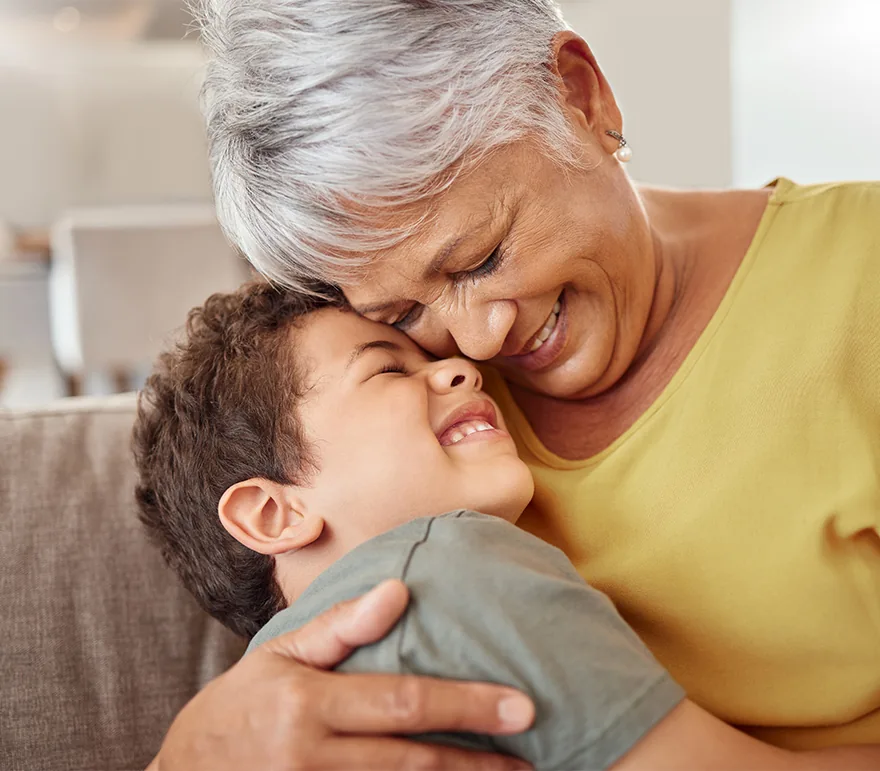 senior woman hugging grandchild