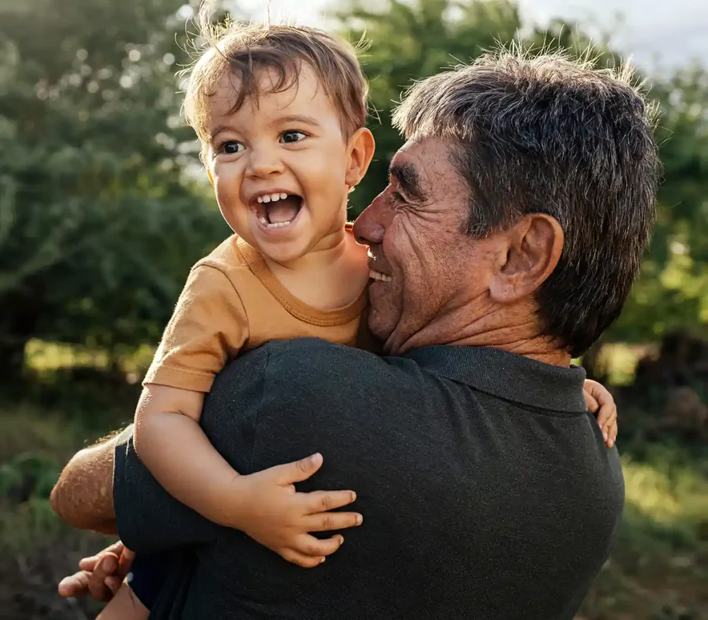 happy grandfather playing with child